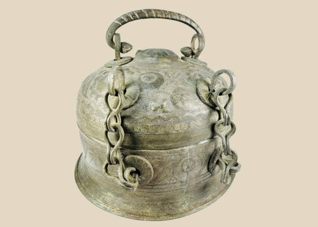 Antique Indian copper Paan Daan (betel box) with domed lid, swing handle, decorative chains, and locking clasp, late 18th–early 19th century.
