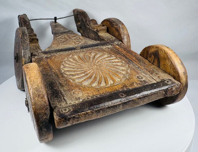 Traditional Indian carved hardwood cart used for ritual or ceremonial purposes