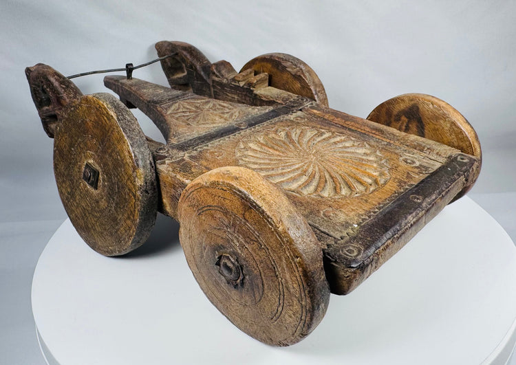Historic hand-carved wooden processional cart likely originating from India