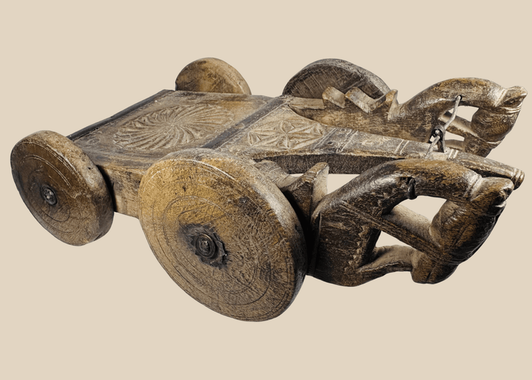 Antique South Asian carved wooden ceremonial cart with four solid wheels and geometric decoration