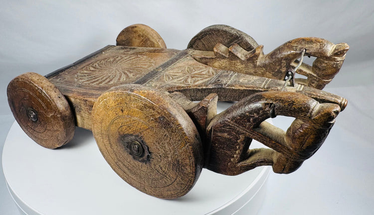 South Asian wooden ceremonial vehicle with decorative rosette and star motifs