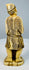 Rear view showing finely incised geometric patterns on the fisherman’s clothing