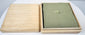 Antique Japanese tsuba with fitted wooden storage box, textile cushion and original collector presentation