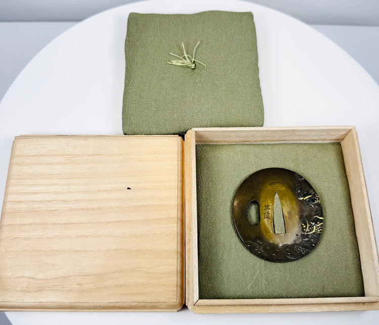 Late Edo Eizui sword guard with central nakago-ana, kozuka-hitsu-ana and Japanese signature beside the opening