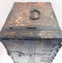 Top view of Japanese ship chest showing large iron carrying handle, deposit slots and heavily worn black finish