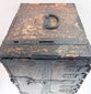 Top view of Japanese ship chest showing large iron carrying handle, deposit slots and heavily worn black finish