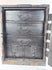 Japanese funa tansu with reinforced front door opened to reveal five interior drawers with traditional iron ring pulls