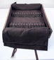 Close view of later fitted drawer insert showing dark anti-tarnish cloth, stitched loops and pull ribbons inside the ship chest