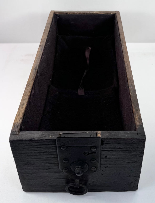 Lower lockable drawer from Japanese funa tansu showing long interior compartment, later textile lining and original iron fittings