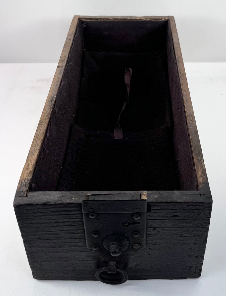 Lower lockable drawer from Japanese funa tansu showing long interior compartment, later textile lining and original iron fittings