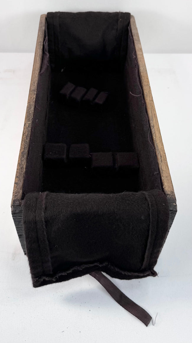 Narrow interior compartment of Japanese funa tansu showing deep wooden drawer body, dark lining and historic wear
