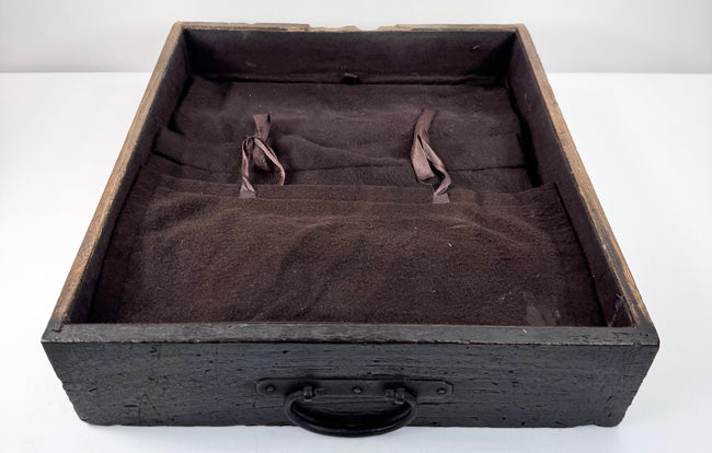 Shallow drawer from antique Japanese funa tansu showing textile-lined interior and large iron ring pull on the drawer front