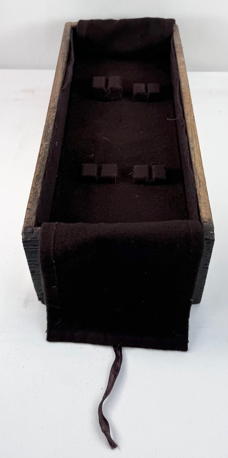 Deep lower drawer of Edo period funa tansu photographed open to show dark interior lining and iron lock hardware at the front