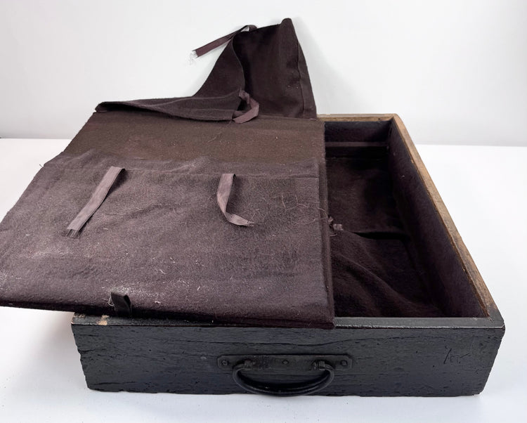 Open drawer from Edo period funa tansu showing later anti-tarnish fabric, ribbon fittings and divided silver storage arrangement