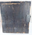 Side view of antique funa tansu displaying iron reinforcement bands, aged wood surface and maritime chest construction