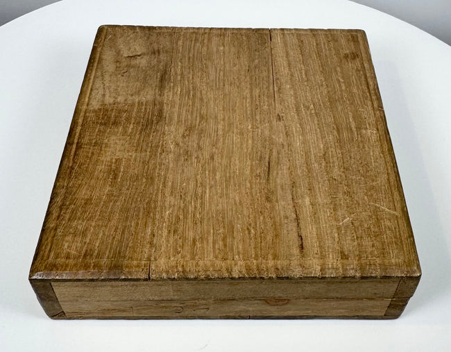 Closed fitted wooden storage box accompanying the antique Japanese Edo–Meiji tsuba