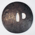 Reverse view of the Japanese iron sword guard showing its dark patina, central nakago-ana, and kozuka-hitsu-ana