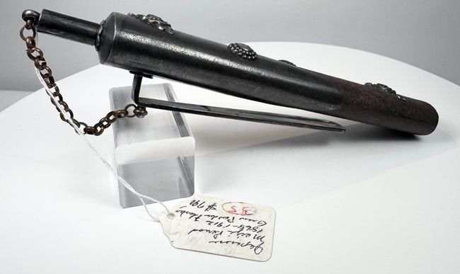 Reverse view of Japanese Meiji gunpowder flask showing long metal belt clip and narrow scabbard-shaped body