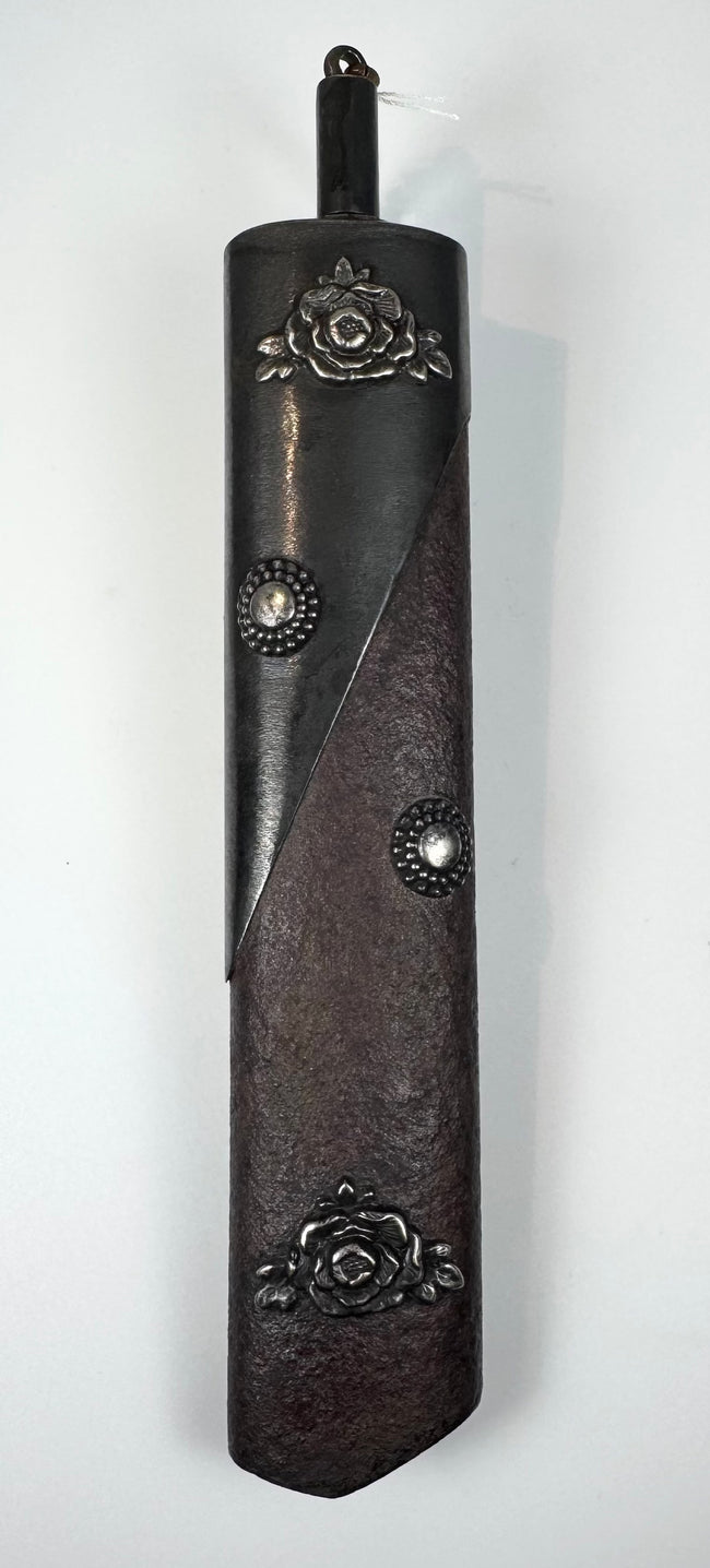 Japanese kayaku-ire gunpowder flask circa 1868–1912 with textured reddish-brown body and silver-coloured floral fittings
