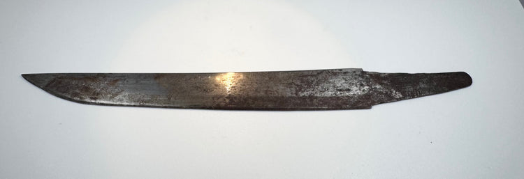Close view of the single-edged steel kogatana blade with aged oxidation and pitting