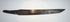 Opposite side of the antique Japanese utility knife blade showing its dark patina