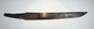 Opposite side of the antique Japanese utility knife blade showing its dark patina