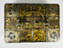 Antique iron-bound valuables chest with arched carrying handle, gilt patterned panels, and original working key.
