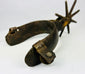 Antique forged iron cowboy spurs with frontier riding heritage and character