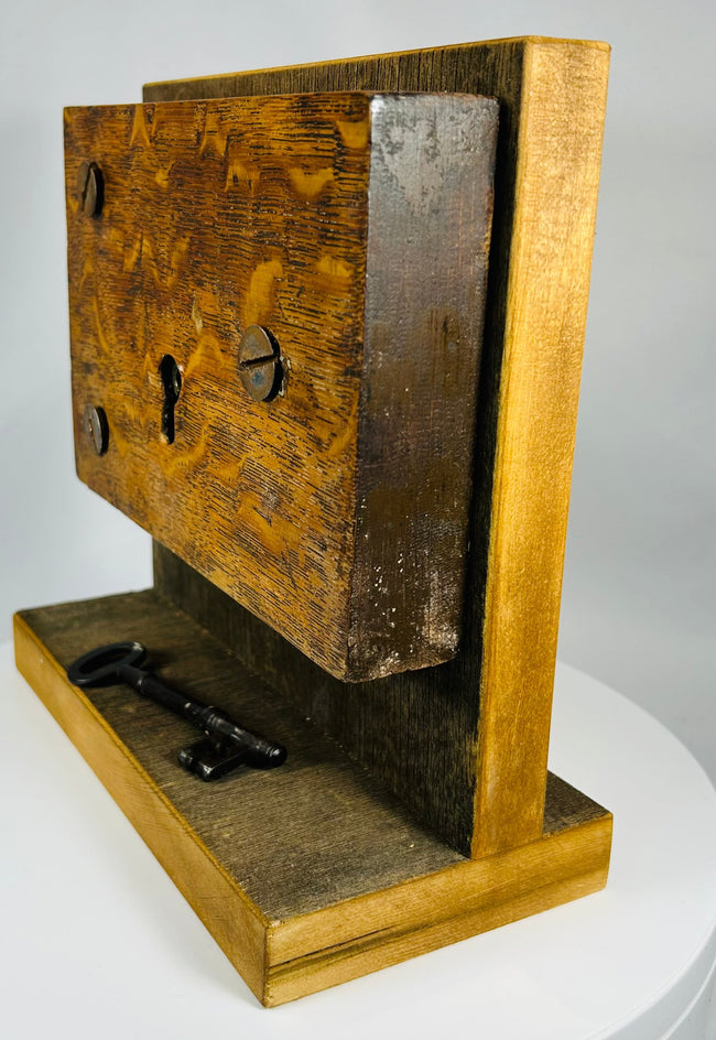 Antique warded lock with iron skeleton key and wooden case construction