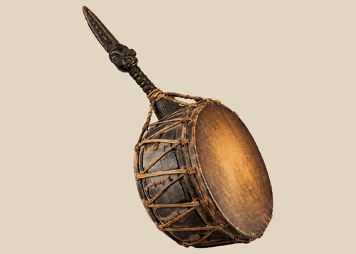 Antique Nepalese Dhyāngro shaman's drum with carved wooden handle, hide drumheads, and original ritual striker.