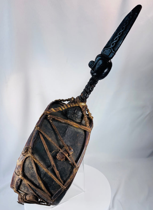 Large Nepalese Dhyāngro ceremonial drum with stretched hide drumheads and hand-carved ritual motifs.