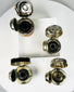 Antique writing tools with glass reservoirs and protective metal tops