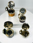Old portable inkwells with worn leather covering and functional lids