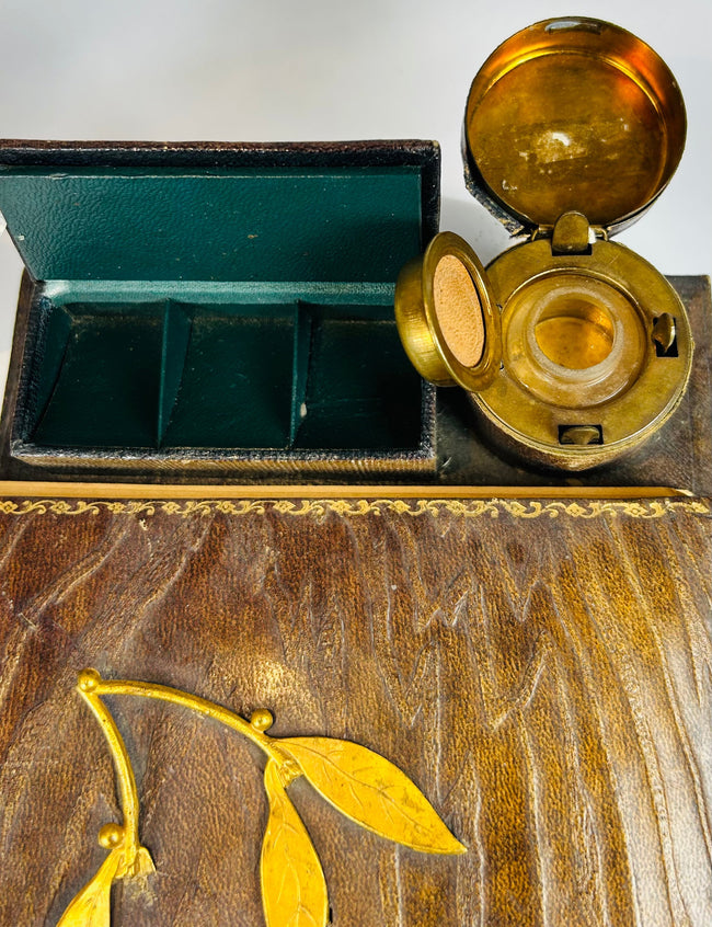 Travel writing desk with inkwell and internal storage compartments
