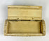 Interior view of an open Napoleonic POW carved bone snuff box showing the original compartment and hand-carved lid on a white background.