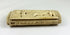 Side view of a Napoleonic POW carved bone snuff box showing relief carving and the hinged lid on a white background.
