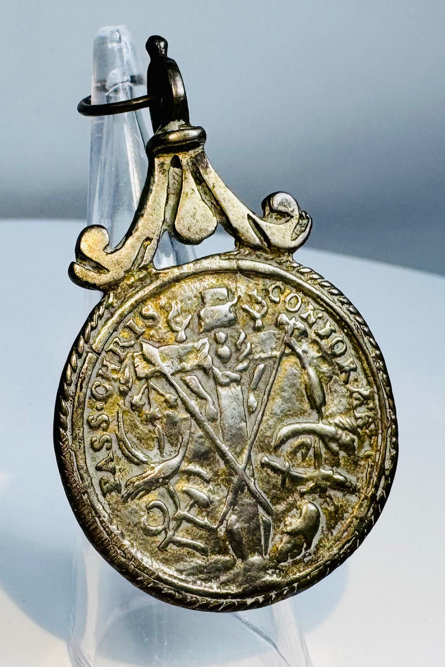 Historic European silver religious medal with Saint Anthony and Christ Child surrounded by devotional inscription.