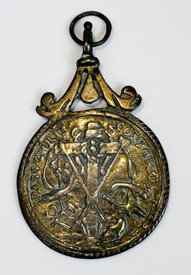 European religious artifact depicting Saint Anthony of Padua, crafted as a wearable devotional medal.