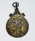 Obverse of an antique Catholic medal showing Saint Anthony of Padua receiving a vision of the infant Jesus.