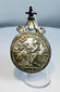 Close-up view of an 18th–19th century Catholic devotional medal featuring Saint Anthony of Padua.