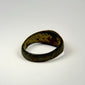 Sassanian Persian silver ring displaying the polished carnelian intaglio and subtle decorative details