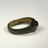 Ancient Persian carnelian intaglio ring with engraved symbolic design and silver band