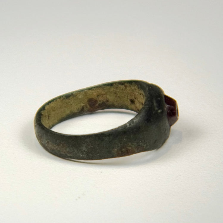Ancient Persian carnelian intaglio ring with engraved symbolic design and silver band