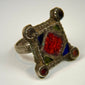 Antique Islamic silver jewelry ring featuring a rectangular decorated bezel and handcrafted folk design