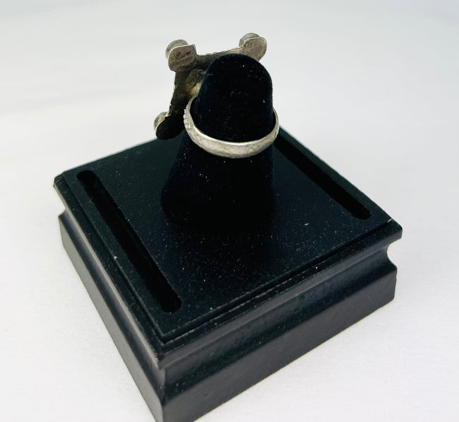 Traditional Maghrebi silver ring, hand-forged with symbolic motifs and aged patina