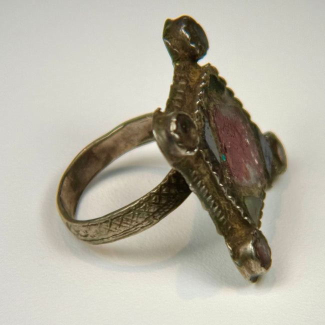 Ottoman Levant-style silver ring with incised bezel decoration, thick shank, and naturally weathered surface