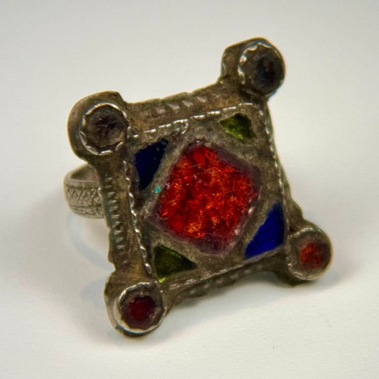 Traditional North African or Middle Eastern silver ring with geometric engraving, aged patina, and substantial band