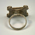 North African silver ring displaying geometric motifs, substantial band construction, and rich aged patina