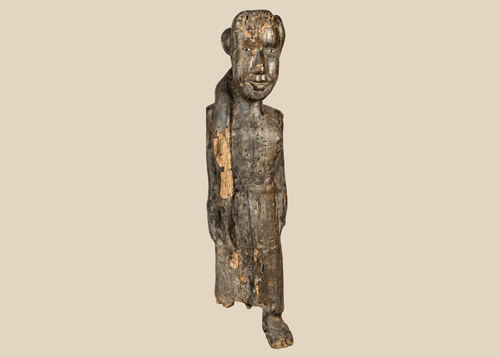 Antique Dayak ancestral wooden figure from Borneo with encrusted patina