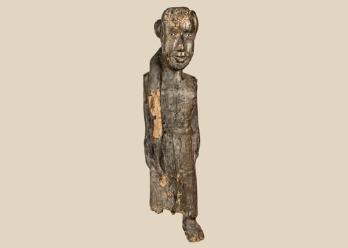 Antique Dayak ancestral wooden figure from Borneo with encrusted patina